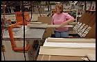 Line worker Janice Wicks of Rumsey, Ky., packs greeting card display marquees, a custom order, at Crescent Plastics in Evansville. Denny Simmons / EBJ