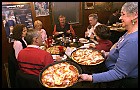 Employee Jean Leslie, right, serves pizza at the Roca Bar, located on South Kentucky Avenue. Sung H. Jun / EBJ
