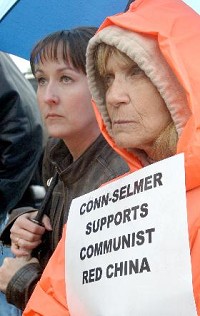 Past employee of Conn-SelmerBrandy Hoogenboom (left) and present employee Pam Neice are part of a group of protesters at a job fair Conn-Selmer held Friday afternoon to find replacement workers for the strikers. Truth Photo By Fred Flury 