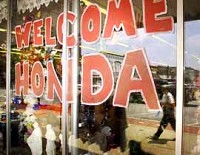 A sign on the front window of Crafts and Occassions in downtown Greensburg welcomes Honda to Indiana. (Photo by Mike Dickbernd)