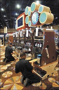 Workers were busy getting the nearly 2,000 electronic games setup in the vast new casino. John P. Cleary / The Herald Bulletin