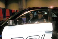 Connersville Deputy Police Chief Dennis Perkins (foreground) and a Carbon Motors official sit in the Carbon E7 law enforcement vehicle in Washington, D.C. in March. The E7 will be on display in Connersville on Tuesday.
