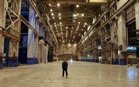 Bill Dosch walks across the main floor that is 1,960-feet long. Dosch started working in 1963 at Westinghouse. The doors at the end of the building are big enough to let railroad cars into the building. (The Star Press file photo)