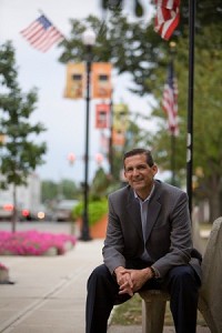 Mayor Jon Costas sits on a bench Wednesday in downtown Valparaiso. The city has been named Community of the Year by the Indiana Chamber of Commerce. The downtown area is among the reasons residents and leaders gave for why the city earned the honor. JON L. HENDRICKS | THE TIMES
