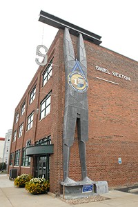 In addition to turning the Shiel Sexton headquarters into a downtown landmark, Executive Vice President Brian Sullivan says the Structure Man sculpture has become something of a mascot. The company’s Website features an interactive game inspired by Structure Man. (IBJ Photo/Robin Jerstad)