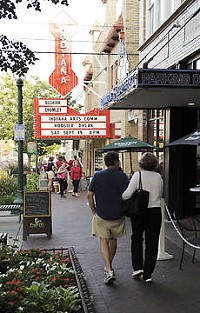 People walk past restaurants on the way to the Buskirk-Chumley Theater on Kirkwood Avenue in downtown Bloomington. The area is part of the Bloomington Entertainment and Arts District. Monty Howell | Herald-Times