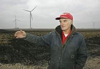 Walt Kelley talks Thursday about the Meadow Lake Wind Farm windmills on his property, Kelley Ridge Farms, west of Brookston. Currently six windmills sit on his farm. "A core group of us like the windmills, and we'll take every one they can put out here," he said. (By John Terhune/Journal &amp; Courier)