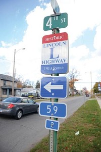 A sign shows the historic route of Lincoln Highway through La Porte. Photo by Matt Fritz