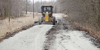 Ken Law operates a road grader on Brown County&rsquo;s Elkinsville Road, which is being turned from pavement into a gravel road. Jeremy Hogan | Herald-Times