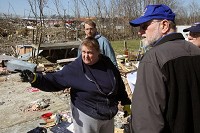 Cindy Cain of Henryville talks to United States Small Business Administration disaster representative Roger Crump on Tuesday morning. The S.B.A, Federal Emergency Management Agency and Indiana Department of Homeland Security toured the area to produce a damage assessment. C.E. Branham photo