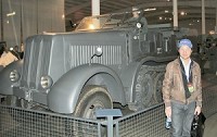 Eric Kauffman of Strasbourg, France, stands beside a Daimler-Benz halftrack that he bought in an auction Saturday at the National Military History Center in Auburn. Kauffman paid the auction&rsquo;s highest price, $200,000 plus a 15 percent buyer&rsquo;s premium, for the vehicle that was used by the German military in World War II. Photo by Brian Glick