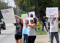 Furloughed Census Bureau workers and family members protest the United States Government shutdown in front of the agency in Jeffersonville on Tuesday afternoon. Staff photo by C.E. Branham