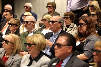 Guests wear 3-D glasses during last month's presentation of "NWI by 2024: The Imperative for Innovation over the Next 10 Years" at Purdue University Calumet's Center for Innovation through Visualization and Simulation. CIVS has saved companies more than $30 million a year by helping U.S. Steel engineers realize they could feed less coke into blast furnaces and still produce the same amount of metal. Staff photo by Jonathan Miano