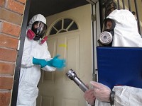 This Nov. 25, 2013 photo shows certified industrial hygienists preparing to enter a house that was once used as a clandestine methamphetamine lab. An Indiana registry of homes contaminated by methamphetamine labs will be available online starting July 1. Staff file photo