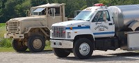 A military surplus 5-ton truck sits beside a modern tanker belonging to the Black Diamond Fire Department in Vermillion County. Staff photo by Jim Avelis