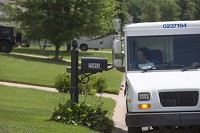 Mail carrier Cindy Fuller delivers mail in St. Joseph County on Tuesday. The Postal Service is hiring carrier associates. Though the positions are temporary, some could lead to full-time positions. (SBT photo/SANTIAGO FLORES)