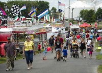The Gibson County Fair midway in Princeton offers visitors a wide selection of fair foods including funnel cakes, corn dogs and lemonade Tuesday afternoon. Staff photo&nbsp; by Denny Simmons