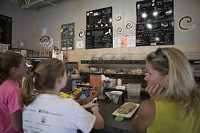 Customers at Studebagels wait for their order on Monday at the South Bend restaurant. The business&nbsp;has entered into a partnership with South Bend Chocolate Co. (SBT Photo/SANTIAGO FLORES)