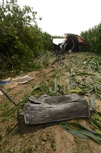 What was left: A radiator lies in a cornfield in Clay County after a towing company pulled the wrecked semi it belonged to out of the field on Friday. Staff photo by Joseph C. Garza