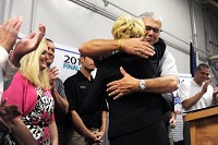 Huntingburg Mayor Denny Spinner, right, hugged Lt. Gov. Sue Ellspermann after Huntingburg was honored this morning as one of two Stellar Communities winners at the Indiana State Fair in Indianapolis. Huntingburg and Wabash, a city southwest of Fort Wayne, were picked from a pool of six finalists. Photo by Mark Felix