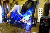 Jake Hendershot welding a piece of metal in the welding class at Kokomo Area Career Center Tim Bath | Kokomo Tribune