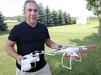 Chris Sanchez shows off the drone he employs to shoot video of attractions in Steuben County. Sanchez is working on a 12-month video project for the Steuben County Tourism Bureau that will show the county over a year&rsquo;s period, highlighting everything from Pokagon State Park to shopping experiences. Oh, and he will include the lakes. Photo by Mike Marturello