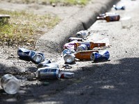 Beer bottles and other trash lines the curbs of section of West Neely Avenue from college students partying Thursday afternoon. (Photo: Corey Ohlenkamp/The Star Press)