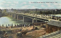 From downtown to the river: A hand-colored post card shows the citizens of Terre Haute walking across one of the earlier Wabash River bridges. Staff photo by Joseph C. Garza