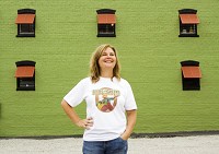 Owner Stacey Freibert is pictured outside of Seeds and Greens Natural Market and Deli located at West First and Main streets in downtown New Albany. Freibert hopes to open the business in time for Harvest Homecoming. Staff photo by Christopher Fryer