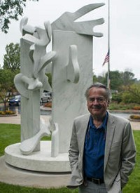 Artist Bill Barrett stands in front of his sculpture titled "Lexeme VIII", which commemorates the September 11 attacks. The artwork was recently installed at Purdue University North Central in Westville. A dedication ceremony was held Thursday morning, September 11, 2014. | Michael Gard/For Sun-Times Media