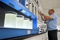 Darin Kemp of the Jasper Water Department prepped samples of raw Patoka River water to be tested Tuesday afternoon at the water treatment facility in Jasper. Jasper water is drawn from the river near the Third Avenue Bridge. Staff photo by Dave Weatherwax