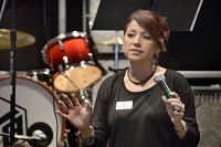 Juanita Mejia-Goodwell, Indiana Youth Institute's Northeastern Indiana Outreach Manager, talks about the importance of moving beyond programs to build relationships with young people in Grant County, during the IYI's Youth Worker Cafe on Thursday at the J.C. Body Shop. Staff photo by Jeff Morehead
