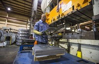Willie Harris operates a 500-ton stamping press Sept. 24 inside General Sheet Metal Works in South Bend. &nbsp;SBT Photo ROBERT FRANKLIN