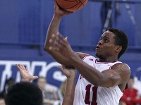 Indiana's Yogi Ferrell (11) goes to the basket against the University of Quebec at Montreal in August. According to an expense summary obtained by The Herald-Times, the trip cost Indiana&rsquo;s athletic department $232,170.58.&nbsp;Andrew Dobrowolskyj | Special to the Herald-Times I
