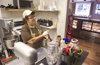 While making some whipped cream, Jeannie Kellams talks about her business, Cleo&rsquo;s Bakery, in Newburgh on Wednesday. She does all the baking for the shop which is named for her mother who &ldquo;was the baker in the family.&rdquo; Staff photo by Kevin Swank
