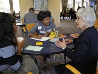 Taya Flores, center, a Journal &amp; Courier reporter, and Loretta Davidson, left, and Felice Bray talk Friday during the Human Library event in the Krannert Drawing Room on the campus of Purdue University. (Photo: John Terhune/Journal &amp; Courier )