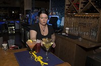 Danyelle George, bartender, works behind the bar last week at Woochi in downtown South Bend. Woochi is among the restaurants that received a riverfront district liquor license that saved the co-owners money over a conventional license. SBT Photo/GREG SWIERCZ