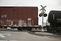 A train crosses an intersection Nov. 11 along County Road 45 in Elkhart County. A growing economy has led to delays for motorists and trains. SBT Photo/SANTIAGO FLORES