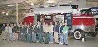 Volunteers who helped restore GM Futurliner No. 10 stand with the vehicle three years ago at the National Military History Center in Auburn. The 1939 vehicle, owned by the National Auto &amp; Truck Museum of Auburn, has been selected for the new National Historic Vehicle Register.