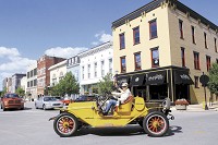 Steve Wooldridge drove his 1914 Apperson automobile from Guyer and Boulevard (Pumpkinvine Pike) to the Haynes Apperson Festival through downtown in a vintage car parade.