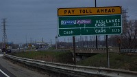 Cars go through the I-PASS/E-Z Pass toll-collection lanes on the Indiana Toll Road in Hammond on April 19, 2013. (Zbigniew Bzdak, Chicago Tribune)