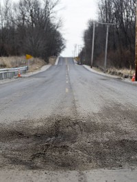 Sections of Ind. 1 south of Farmland are failing less than four months after the state completed $3 million in reconstruction. The highway is shut down. (Photo: Jordan Huffer / The Star Press)