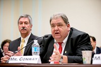 United Steel Workers International Vice President Thomas Conway, right, accompanied by U.S. Steel Corp. CEO Mario Longhi, speaks during a Congressional Steel Caucus hearing in Washington, on Thursday. Staaff photo by Keith Benman