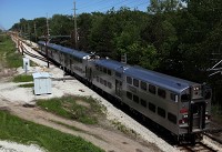 A double-decker South Shore rail car leaves the Dune Park South Shore station in Porter. Staff photo by Jonathan Miano