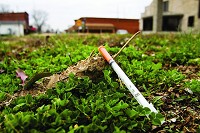 A discarded syringe, such as this one found along downtown's West Main Street,&nbsp;has become common debris in&nbsp;Austin, a community beset by an HIV crisis linked to intravenous drug addiction. News and Tribune Staff photo by Christopher Frye