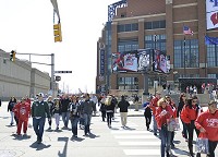Final Four Drive: Fans cross the street in downtown Indy Saturday afternoon by Final Four Drive. Downtown Indianapolis saw tens of thousands of basketball fans as part of the NCAA Final Four at Lucal Oil Stadium last night. Staff photo by Alexis Rusch