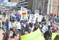Equal rights for all: Hundreds marched from Monumental Circle to Lucal Oil Stadium Saturday to show that they are not satisfied with the recent changes to RFRA and more needs to be done. Staff photo by Alexis Rusch