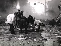 Firefighters and volunteers work together to rescue a man injured in the explosions in downtown Richmond on April 6, 1968. Forty-one died and more than 120 were injured. Photo supplied