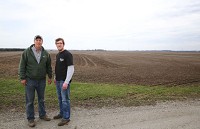 Robert Sands, left, with his son Brandon on the family's 300-plus acre farm where they have asked the county to rezone 40 acres of their Morgan Township farmland to allow for a confined feeding operation to raise just short of 6,000 pigs at a time. Opposition is growing ahead of an upcoming public hearing on the request. Buildings for the pigs would be located at right near the tree line. Staff photo by John Luke