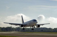 A Boeing 757 lands at Grissom Air Reserve Base, Ind., July 16, 2014. The aircraft is the first to land on the newly renovated runway following a $3.2 million project that added expansion joints in the runway. (U.S. Air Force photo/Staff Sgt. Ben Mota)